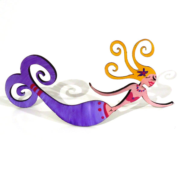 Hand painted steel sculpture of a whimsical mermaid facing down in popsicle purple, available at Cerulean Arts. Curled tail and hair of sculpture can serve as a photo or business card holder.