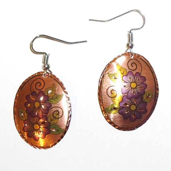Etched copper floral earrings with purple ovals design available at Cerulean Arts.