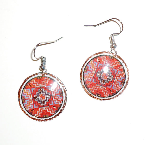 Etched copper geometric earrings with red circle design available at Cerulean Arts.