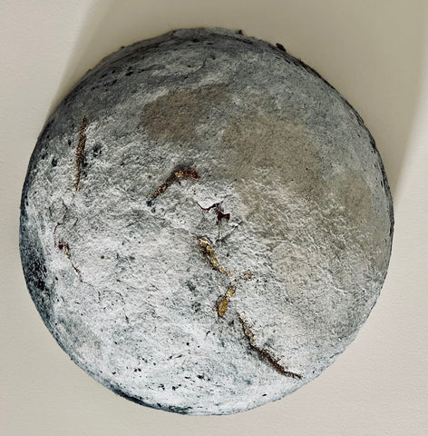 Fire and Ice, paper pulp, lava stones, pigment and gold foil sculpture by Cerulean Arts Collective Member Anne Marble